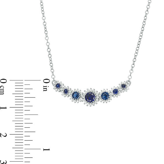 Lab-Created Blue Sapphire and 1/5 CT. T.W. Diamond Seven Stone Sunburst Frame Necklace in Sterling Silver Lab-Created Blue Sapphire and 1/5 CT. T.W. Diamond Seven Stone Sunburst Frame Necklace in Sterling Silver