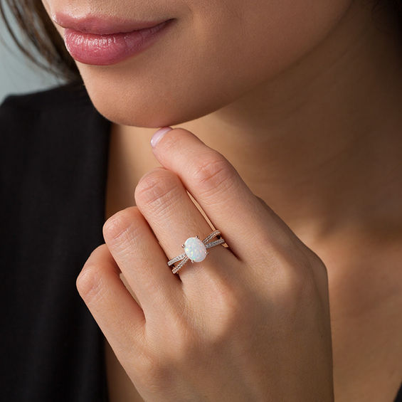 Oval Opal and 1/4 CT. T.w. Diamond Crossover Ring in Sterling Silver and Rose Rhodium