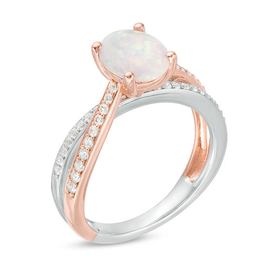 Oval Opal and 1/4 CT. T.w. Diamond Crossover Ring in Sterling Silver and Rose Rhodium