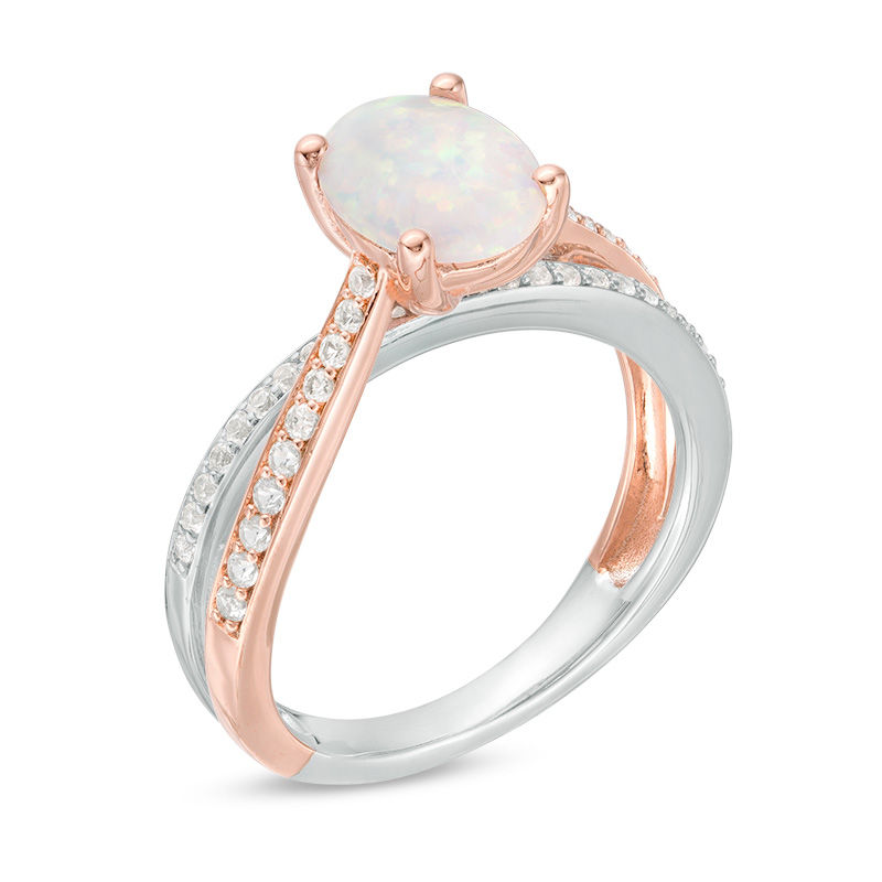 Oval Opal and 1/4 CT. T.W. Diamond Crossover Ring in Sterling Silver and Rose Rhodium