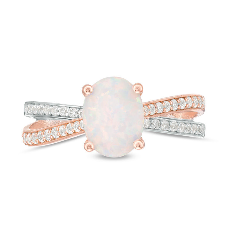 Oval Opal and 1/4 CT. T.W. Diamond Crossover Ring in Sterling Silver and Rose Rhodium