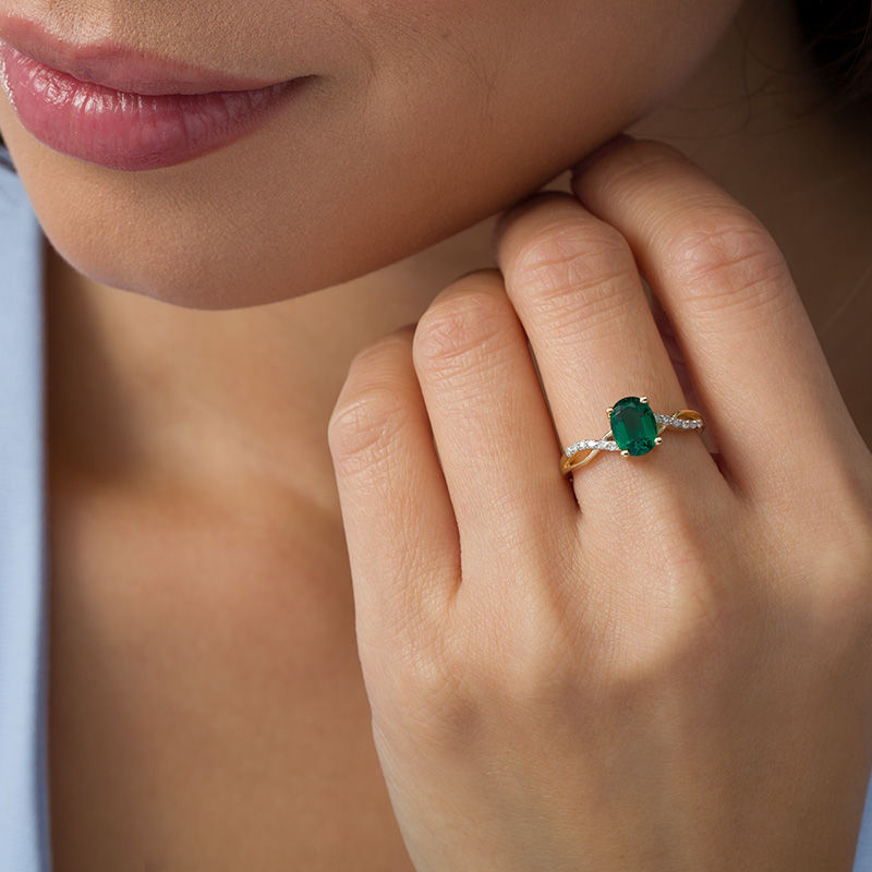 Main Image 2 of Oval Lab-Created Emerald and 1/20 CT. T.W. Diamond Twist Shank Ring in 10K Gold