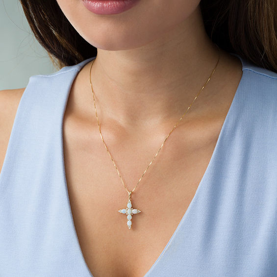 Oval Opal and 1/6 CT. T.W. Diamond Trio Pointed Cross Pendant in 14K Gold Oval Opal and 1/6 CT. T.W. Diamond Trio Pointed Cross Pendant in 14K Gold