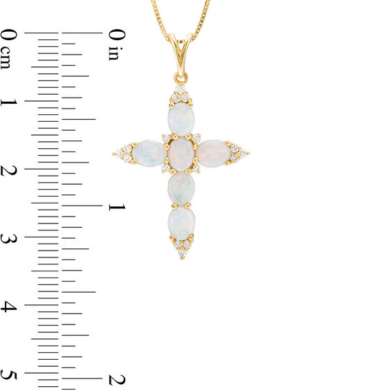 Oval Opal and 1/6 CT. T.W. Diamond Trio Pointed Cross Pendant in 14K