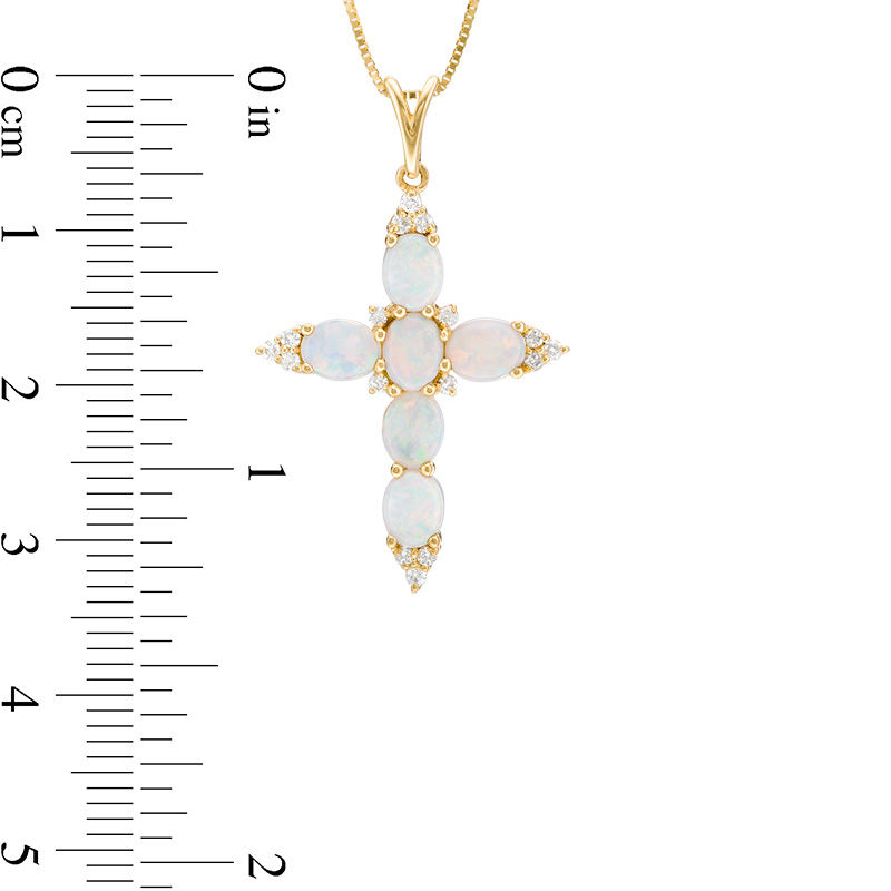 Oval Opal and 1/6 CT. T.W. Diamond Trio Pointed Cross Pendant in 14K Gold