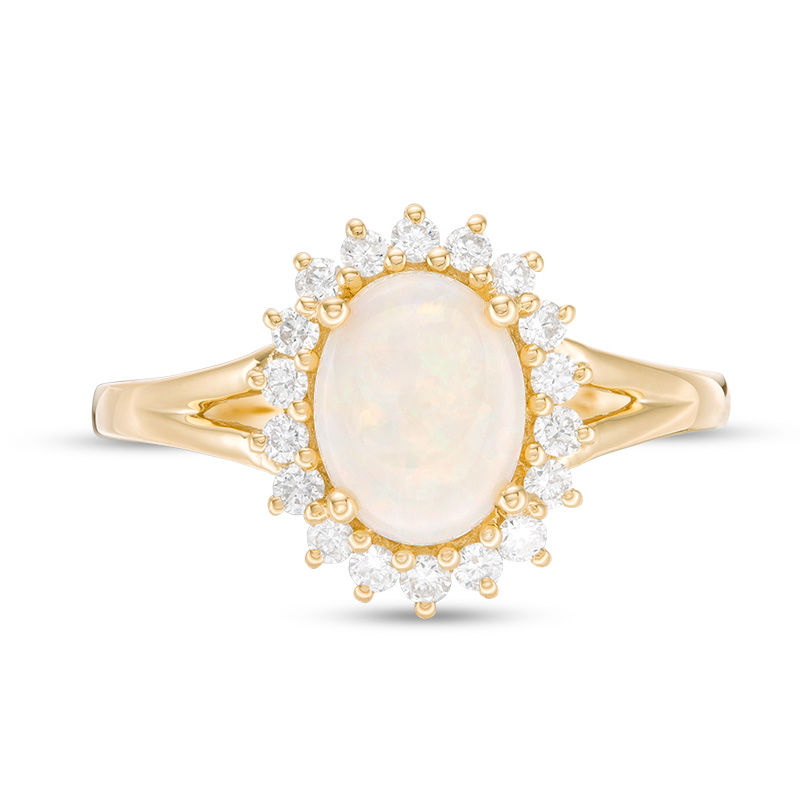 Oval Opal and 1/3 CT. T.W. Diamond Sunburst Frame Ring in 14K Gold