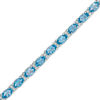 Thumbnail Image 0 of Oval Blue Topaz and Lab-Created White Sapphire Line Bracelet in Sterling Silver