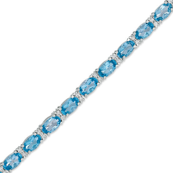 Oval Blue Topaz and Lab-Created White Sapphire Line Bracelet in Sterling Silver