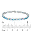 Thumbnail Image 2 of Oval Blue Topaz and Lab-Created White Sapphire Line Bracelet in Sterling Silver