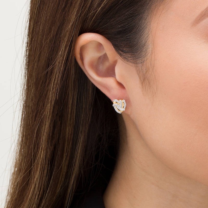 Main Image 2 of 1/8 CT. T.W. Diamond Heart-Shaped Love Knot Stud Earrings in 10K Gold