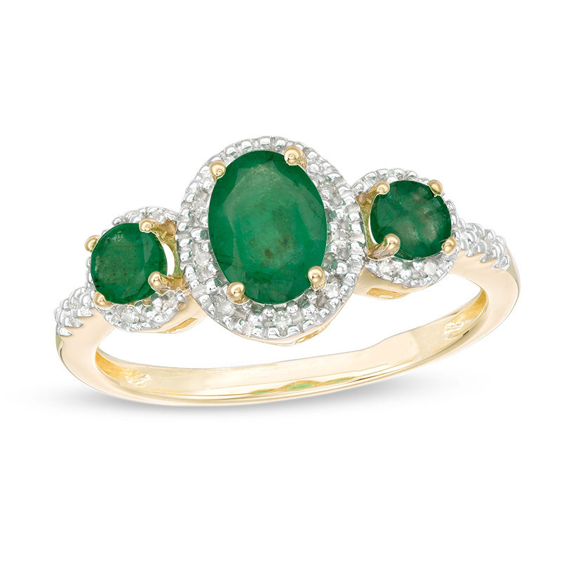 Oval Emerald and 1/20 CT. T.W. Diamond Three Stone Frame Ring in 10K Gold - Size 7