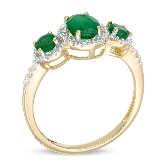 Oval Emerald and 1/20 CT. T.w. Diamond Three Stone Frame Ring in 10K Gold - Size 7