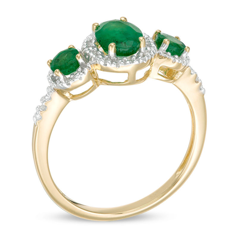 Oval Emerald and 1/20 CT. T.W. Diamond Three Stone Frame Ring in 10K Gold - Size 7