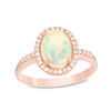 Thumbnail Image 0 of Oval Opal and 1/6 CT. T.W. Diamond Frame Ring in 14K Rose Gold