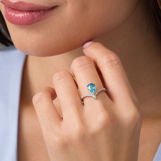 Pear-Shaped and Round Blue Zircon with 1/20 CT. T.w. Diamond Chevron Ring in 14K White Gold