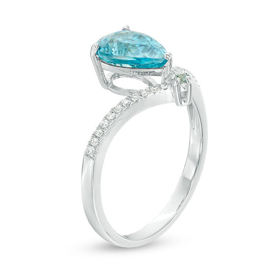 Pear-Shaped and Round Blue Zircon with 1/20 CT. T.w. Diamond Chevron Ring in 14K White Gold