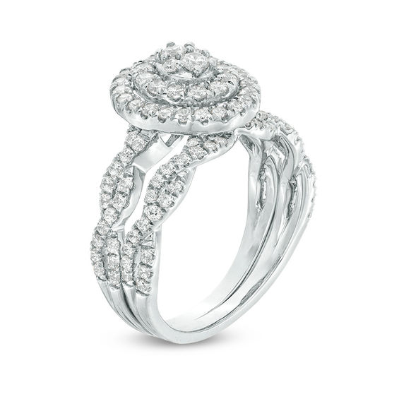 3/4 CT. T.w. Oval Multi-Diamond Double Frame Twist Bridal Set in 10K White Gold