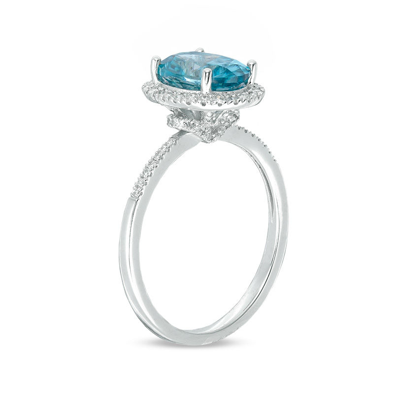 Oval Blue Zircon and 1/4 CT. T.W. Diamond Frame Engagement Ring in 14K White Gold