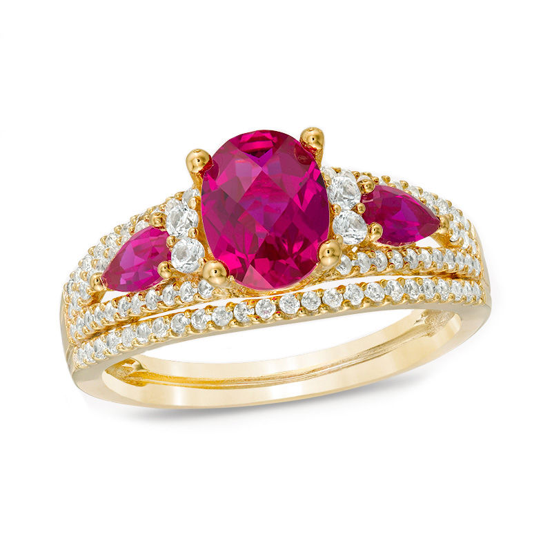 Oval Lab-Created Ruby and 1/2 CT. T.W. Diamond Three Stone Ring in 10K Gold
