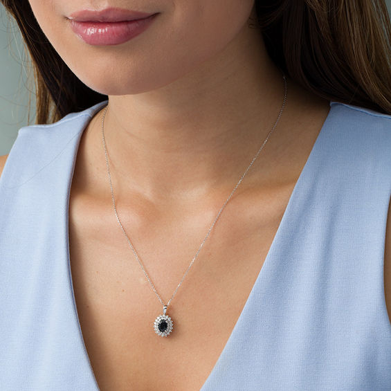 Certified Oval Blue Sapphire and 1/2 CT. T.w. Diamond Starburst Frame Pendant in 14K White Gold