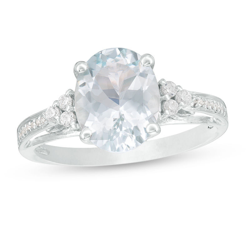 Oval Aquamarine and 1/8 CT. T.W. Diamond Tri-Sides Ring in 10K White Gold
