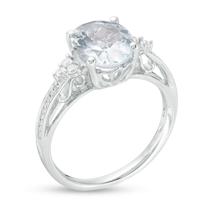 Oval Aquamarine and 1/8 CT. T.W. Diamond Tri-Sides Ring in 10K White Gold