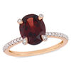 Thumbnail Image 0 of Oval Garnet and 1/10 CT. T.W. Diamond Engagement Ring in 10K Rose Gold