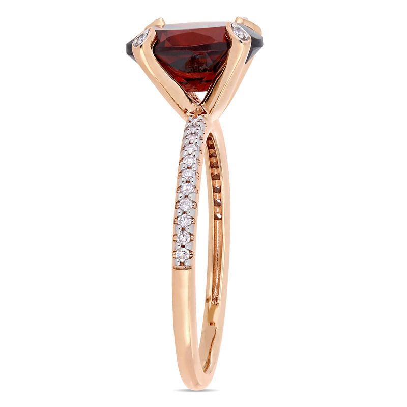 Oval Garnet and 1/10 CT. T.W. Diamond Engagement Ring in 10K Rose Gold