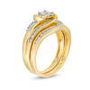 1/2 CT. T.W. Diamond Bypass Swirl Bridal Set in 10K Gold