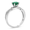 Thumbnail Image 1 of 5.5mm Emerald and 1/6 CT. T.W. Diamond Double Row Open Crossover Engagement Ring in 18K White Gold