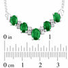 Thumbnail Image 1 of Alternating Oval Emerald and 1/5 CT. T.W. Diamond Chevron Necklace in 14K White Gold - 17.33"