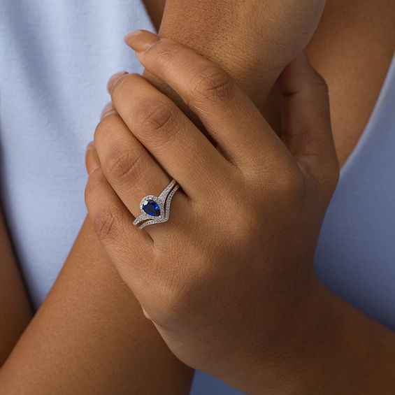 Pear-Shaped Lab-Created Blue Sapphire and 1/4 CT. T.w. Diamond Frame Chevron Bridal Set in Sterling Silver
