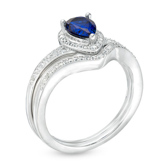 Pear-Shaped Lab-Created Blue Sapphire and 1/4 CT. T.w. Diamond Frame Chevron Bridal Set in Sterling Silver