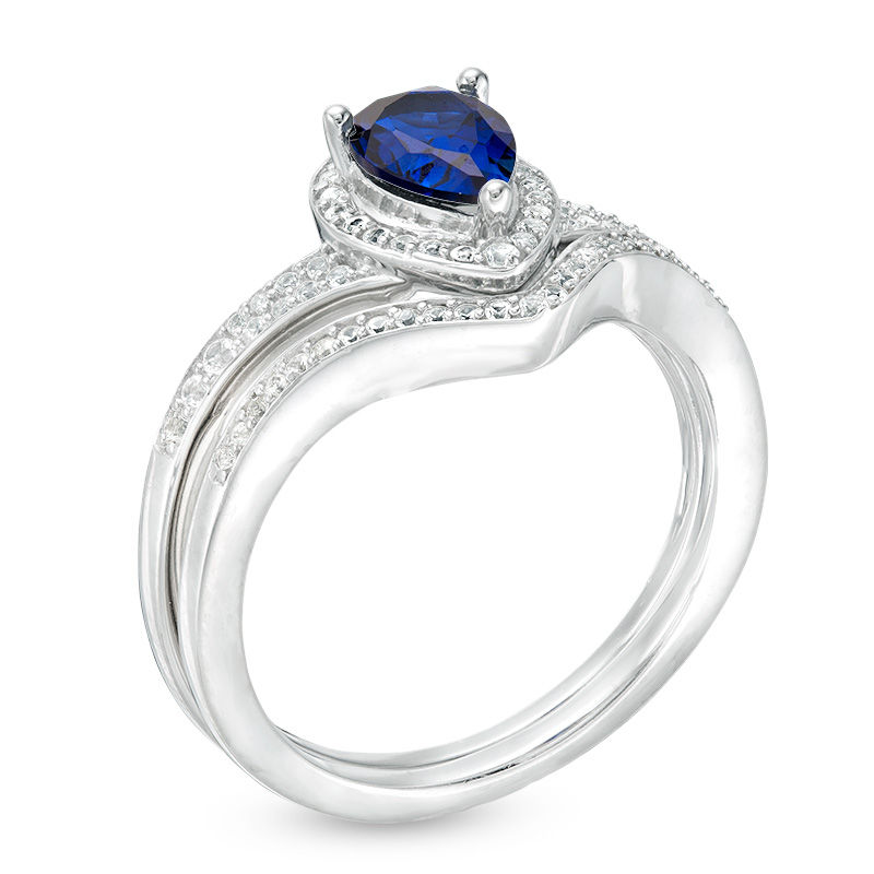 Pear-Shaped Lab-Created Blue Sapphire and 1/4 CT. T.W. Diamond Frame Chevron Bridal Set in Sterling Silver