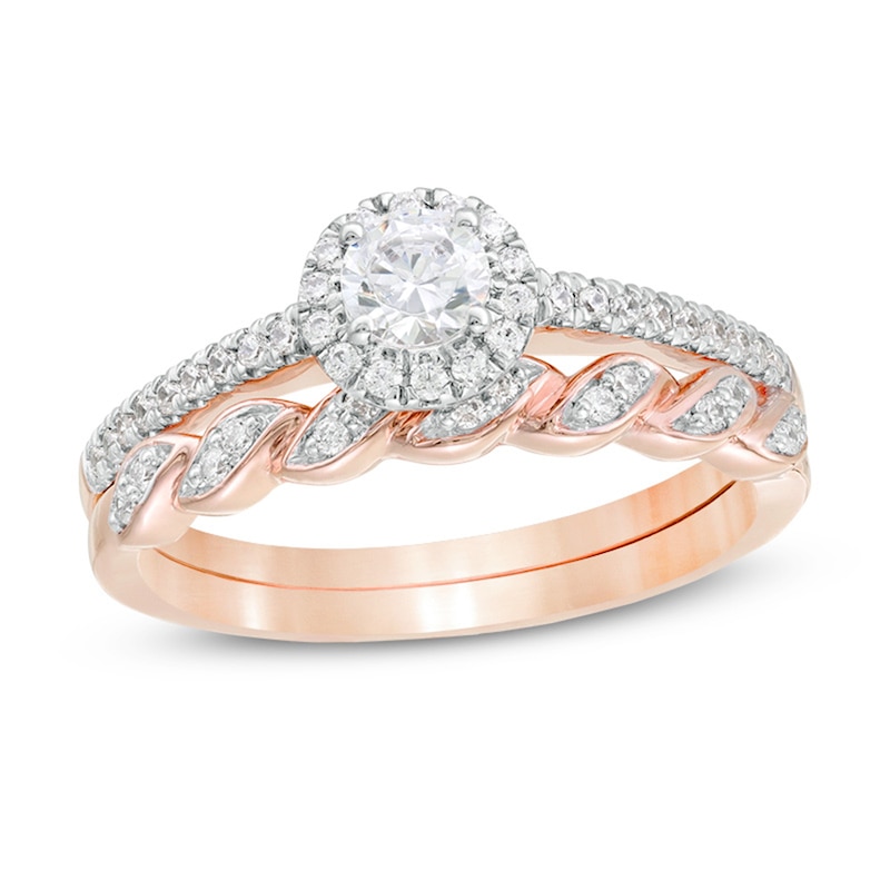 Main Image 1 of 1/2 CT. T.W. Diamond Frame Twist Shank Bridal Set in 10K Rose Gold