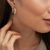 Thumbnail Image 2 of 1-1/2 CT. T.W. Baguette Diamond Hoop Earrings in 14K Gold