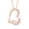 Thumbnail Image 1 of 1/4 CT. T.W. Baguette and Round Diamond Scatter Tilted Heart Pendant in 10K Rose Gold