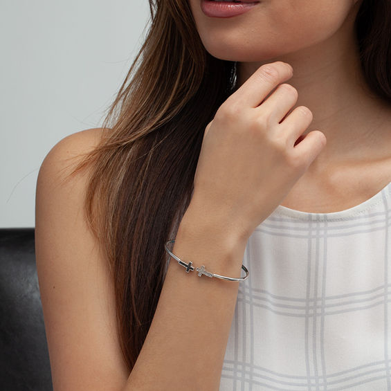 1/10 CT. T.w. Enhanced Black and White Diamond Sideways Cross Open Flex Bangle in Sterling Silver