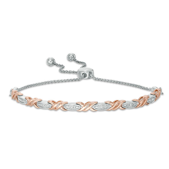 1/15 CT. T.W. Diamond Layered "XO" Bolo Bracelet in Sterling Silver and 10K Rose Gold - 9.5" 1/15 CT. T.W. Diamond Layered "XO" Bolo Bracelet in Sterling Silver and 10K Rose Gold - 9.5"