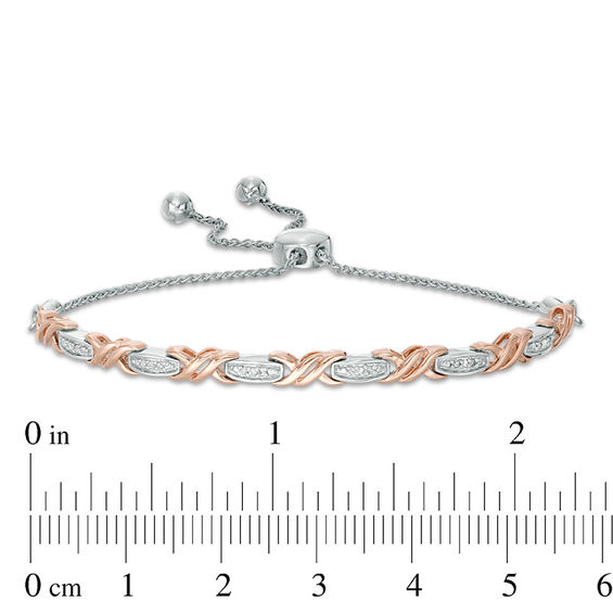 1/15 CT. T.W. Diamond Layered "XO" Bolo Bracelet in Sterling Silver and 10K Rose Gold - 9.5" 1/15 CT. T.W. Diamond Layered "XO" Bolo Bracelet in Sterling Silver and 10K Rose Gold - 9.5"
