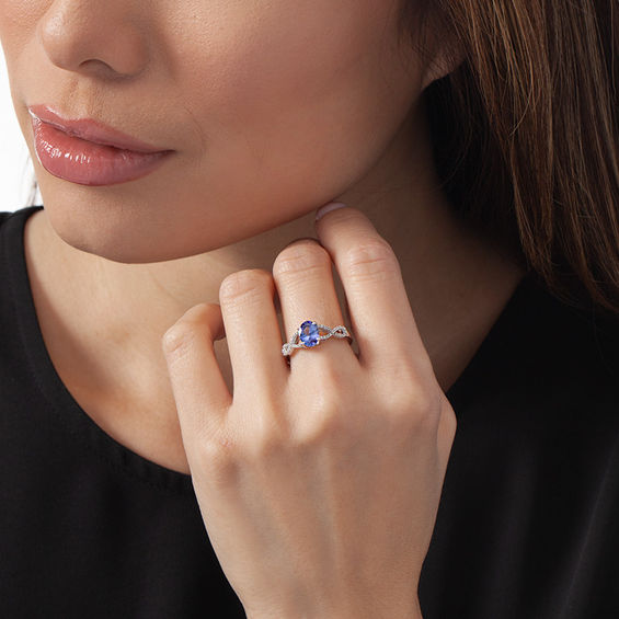 Oval Tanzanite and 1/15 CT. T.w. Diamond Twist Shank Ring in 10K White Gold
