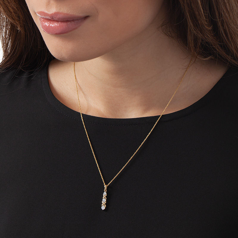 Main Image 2 of 1/3 CT. T.W. Diamond Three Stone "XO" Pendant in 10K Gold