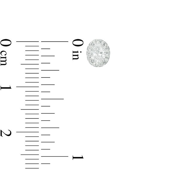 1/2 CT. T.w. Certified Oval Diamond Frame Stud Earrings in 14K White Gold (I/Si2)