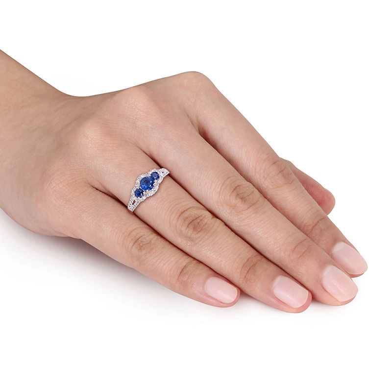 Blue Sapphire and 1/4 CT. T.W. Diamond Frame Three Stone Split Shank Ring in 10K White Gold