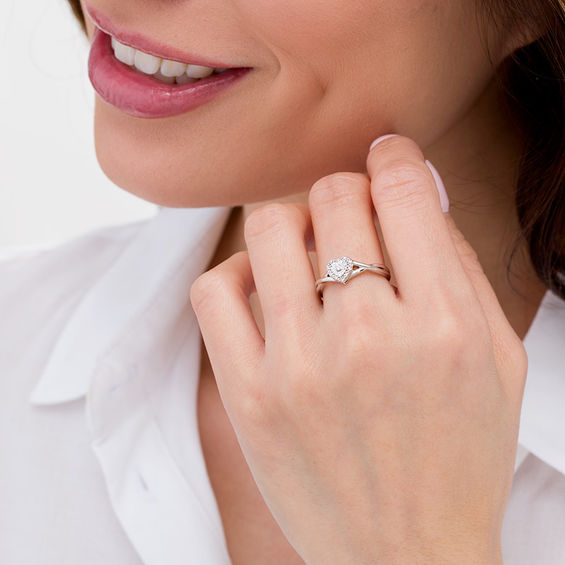 1/20 CT. T.w. Diamond Heart Frame Twist Ring in Sterling Silver