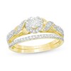 Thumbnail Image 0 of 1/2 CT. T.W. Diamond Frame Twist Shank Bridal Set in 10K Gold