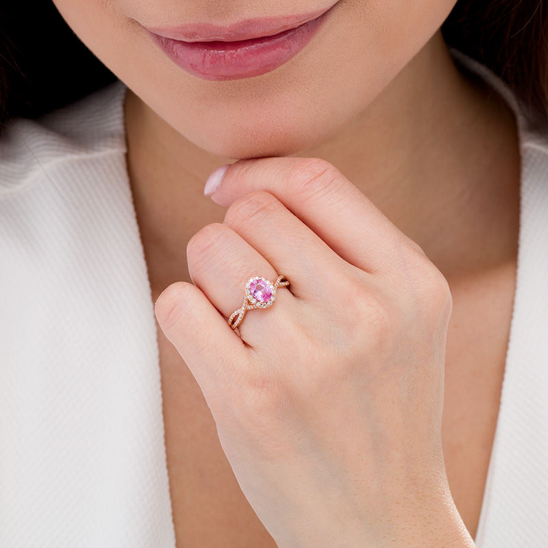 Main Image 2 of Oval Pink Sapphire and 1/3 CT. T.W. Diamond Frame Crossover Shank Ring in 14K Rose Gold