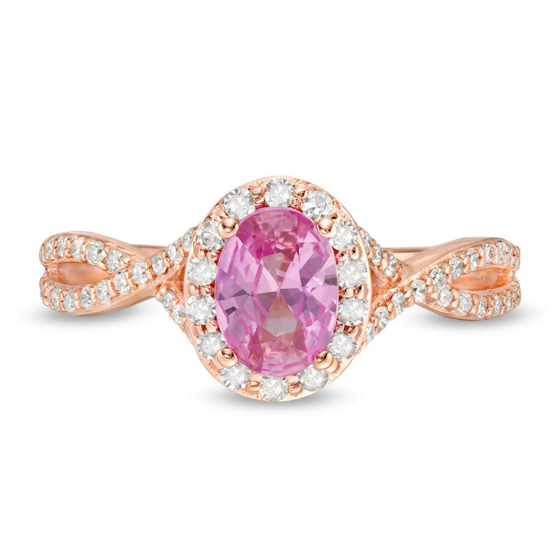 Oval Pink Sapphire and 1/3 CT. T.W. Diamond Frame Crossover Shank Ring in 14K Rose Gold