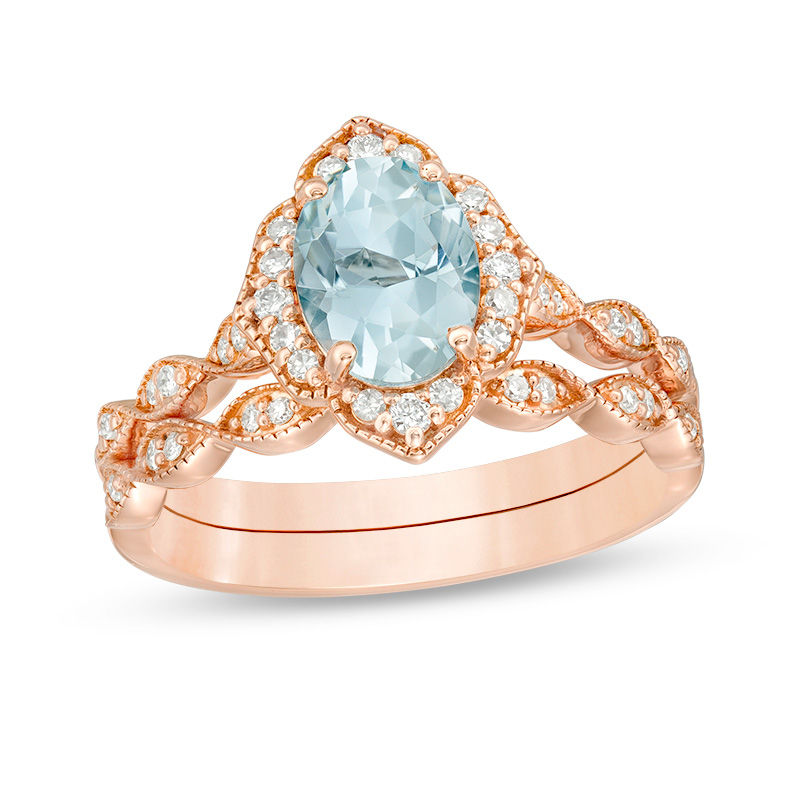 Main Image 1 of Oval Aquamarine and 1/3 CT. T.W. Diamond Petal Frame Vintage-Style Bridal Set in 14K Rose Gold