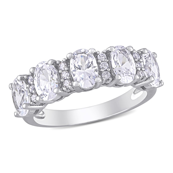 Oval Lab-Created White Sapphire and 1/10 CT. T.w. Diamond Five Stone Ring in 10K White Gold